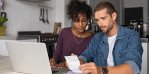 A young couple reviewing their estate planning resources.
